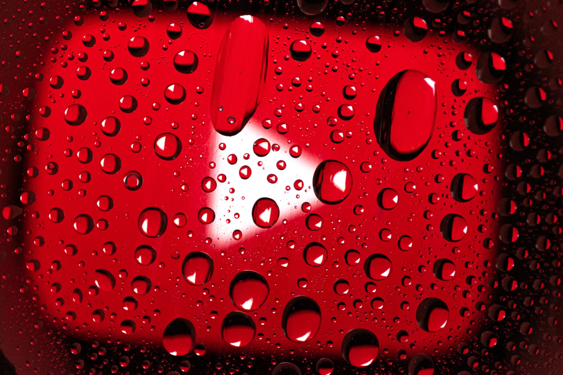 water droplets on red surface